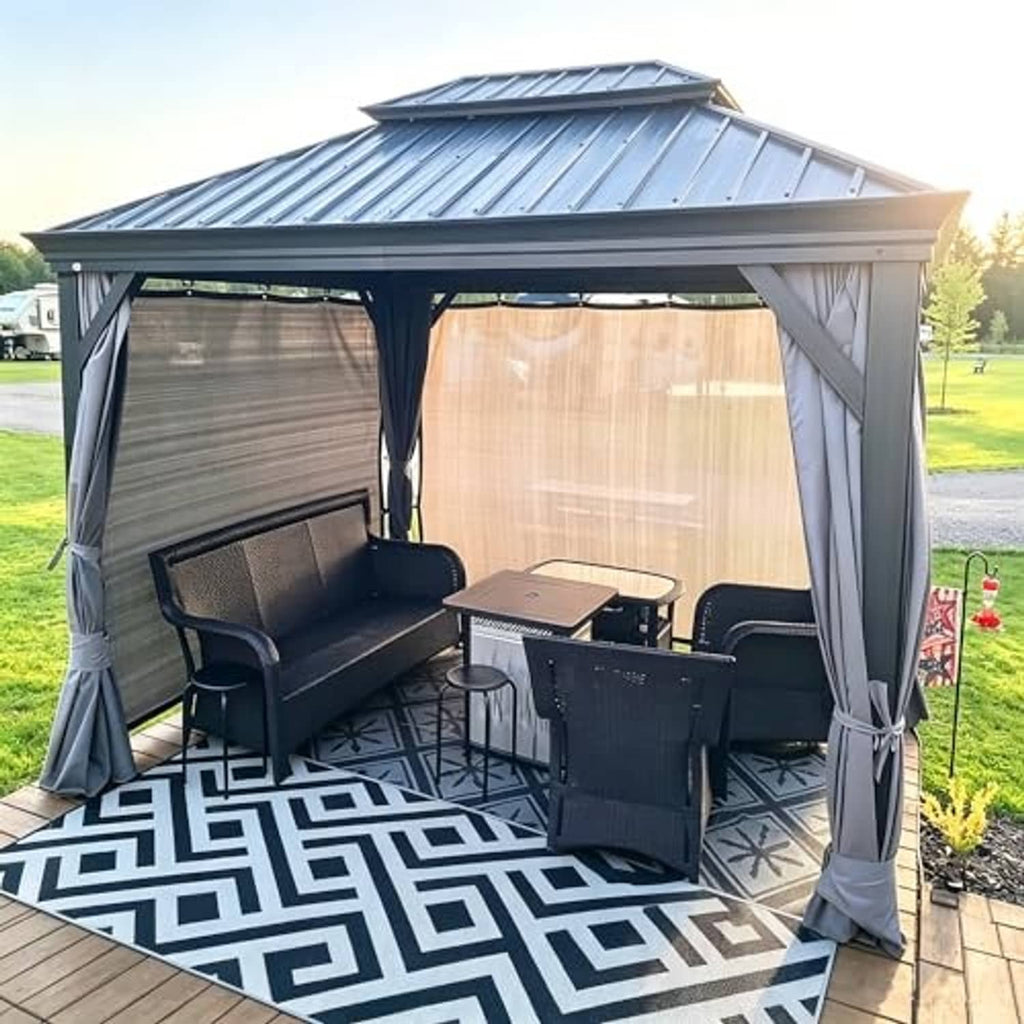 Sand sun shade screen attached to a pergola with grey curtains