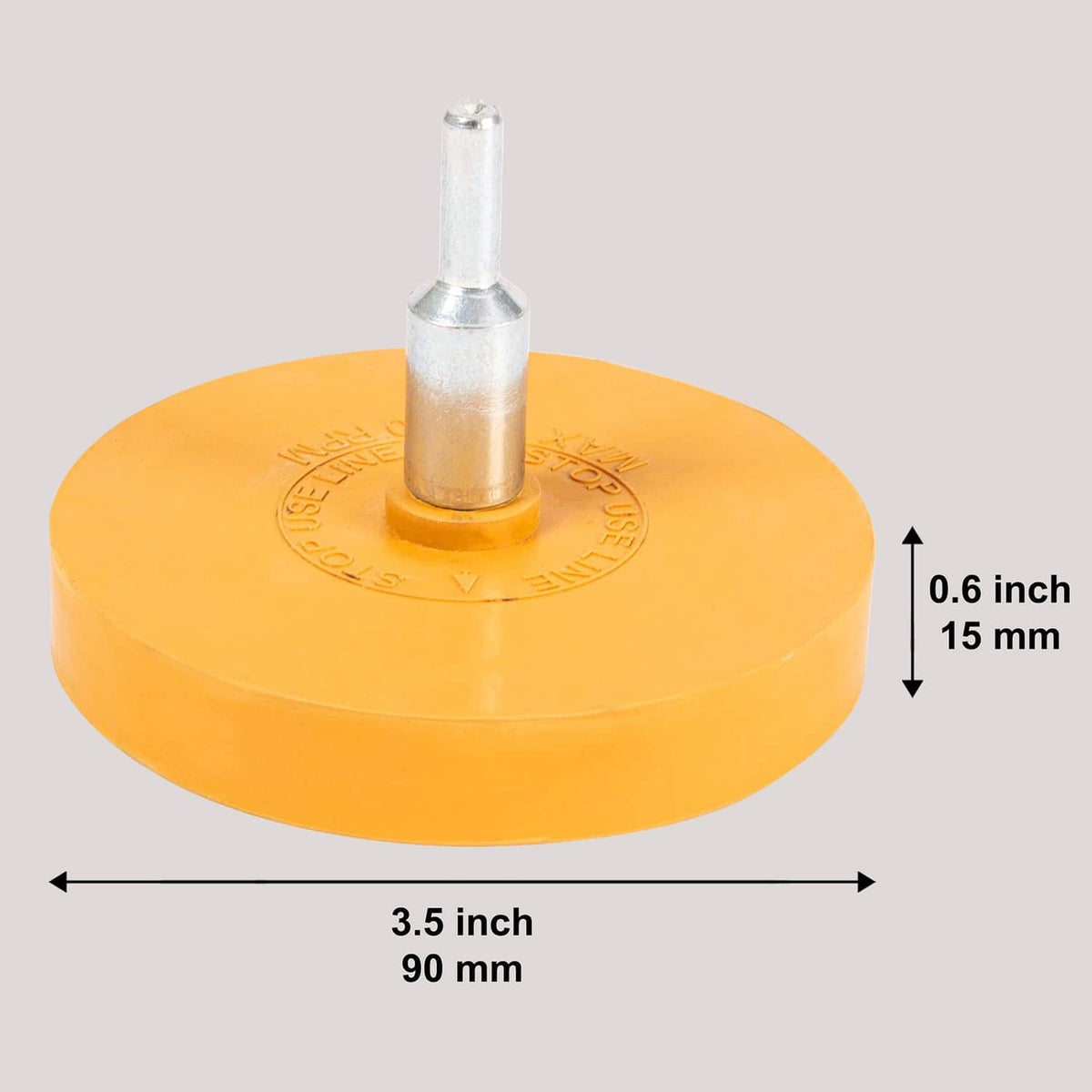 Yellow rubber eraser wheel with metal arbor, 3.5 in wide and 0.6 in tall