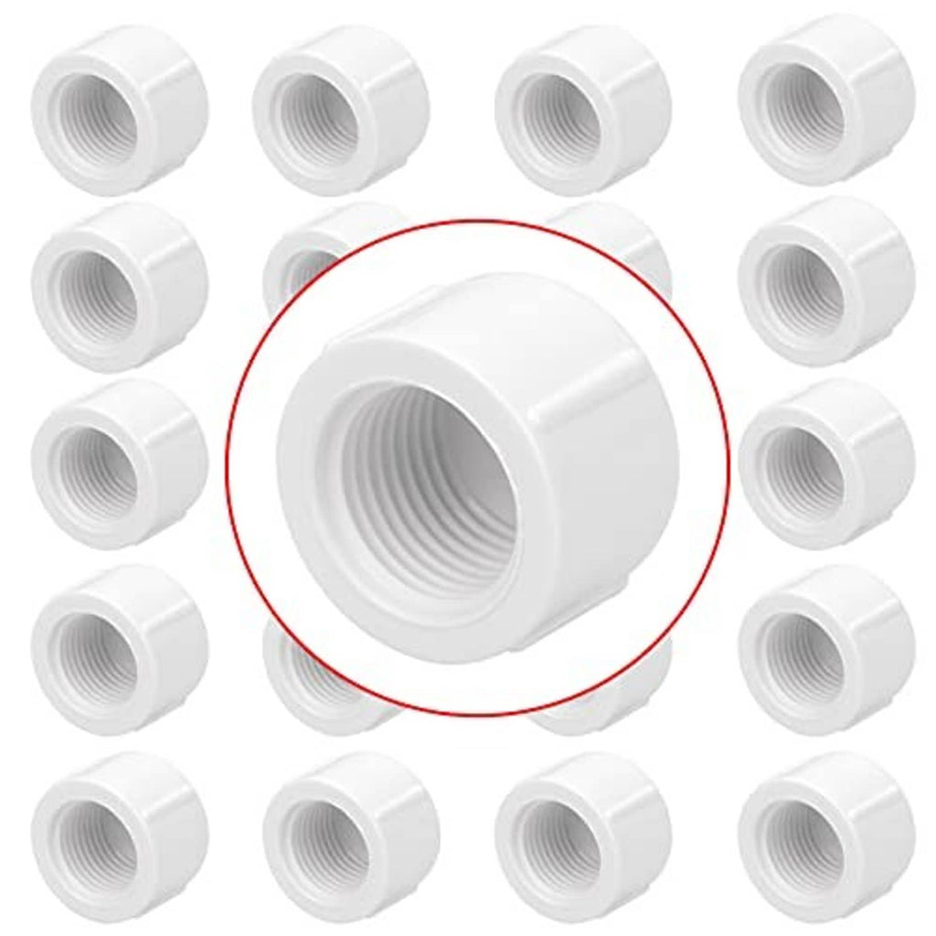 Set of white PVC 1/2 inch female threaded pipe end caps, cylindrical pieces with threads