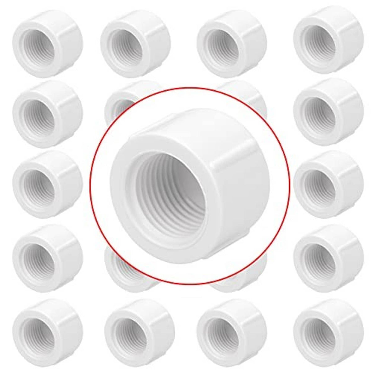 Set of white PVC 1/2 inch female threaded pipe end caps, cylindrical pieces with threads