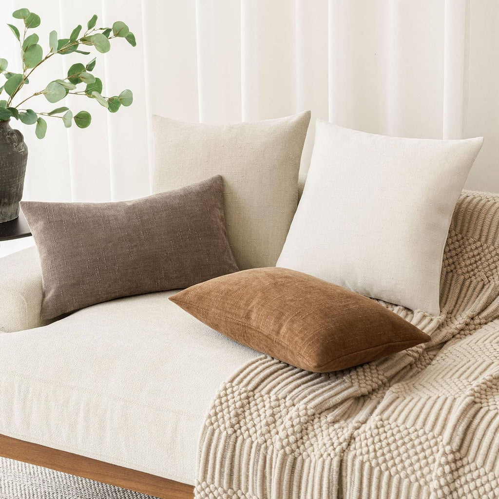 Cement textured chenille throw pillow, light beige square cushion with centered woven texture.