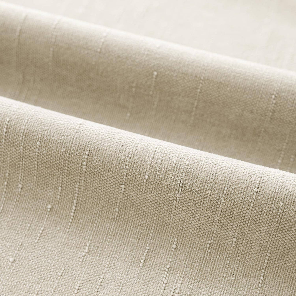 Textured chenille pillow back panel, light beige fabric with subtle woven specks.