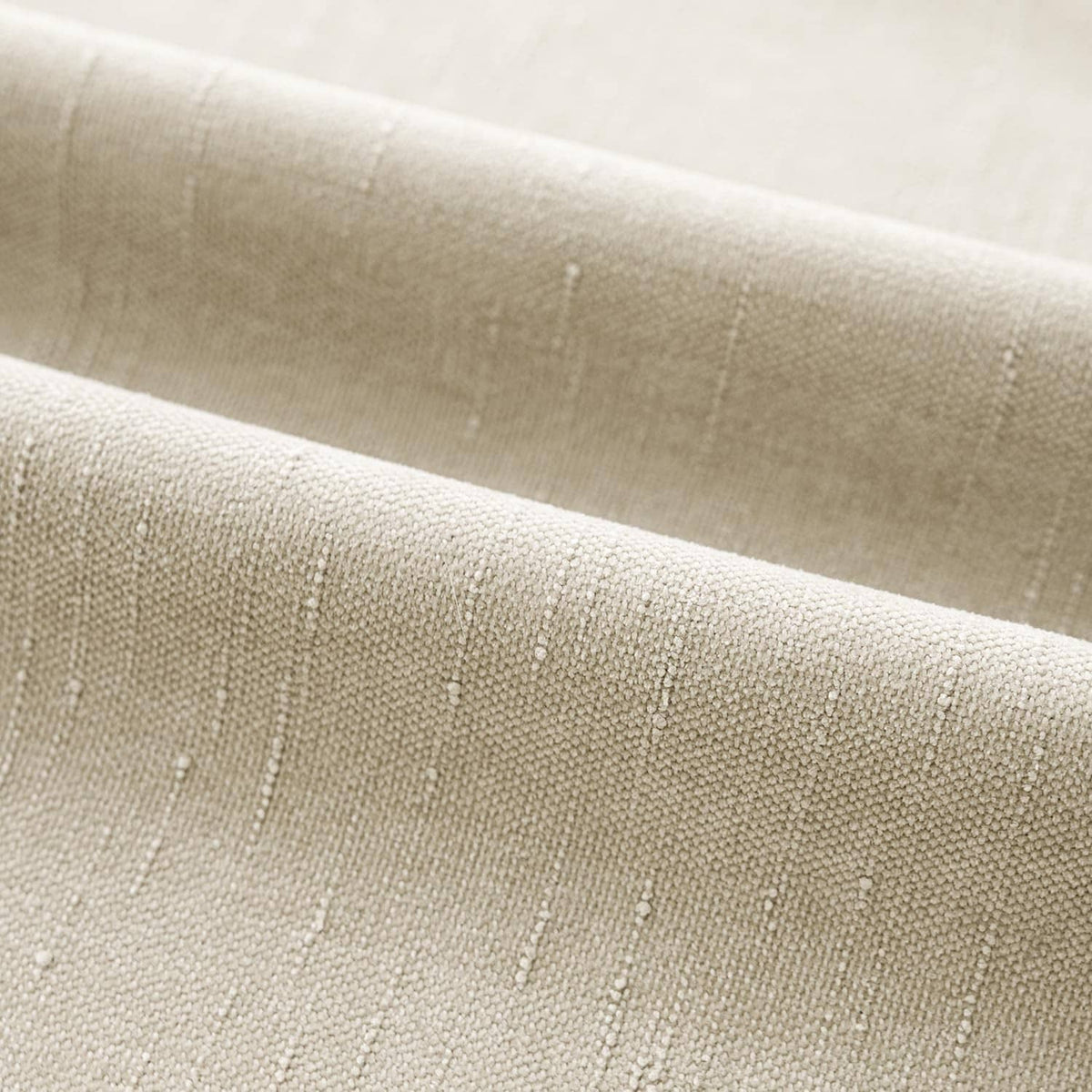 Textured chenille pillow back panel, light beige fabric with subtle woven specks.