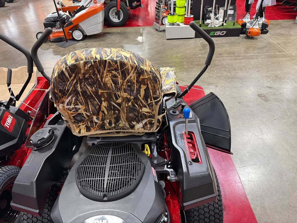 Camouflage mower seat cover with black fan grille and front panel on Timecutter mower