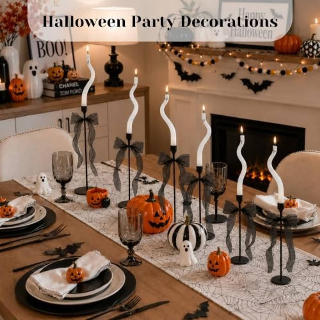 Twisting white ghost candle set with black bases, mesh bow accents, and flame tips