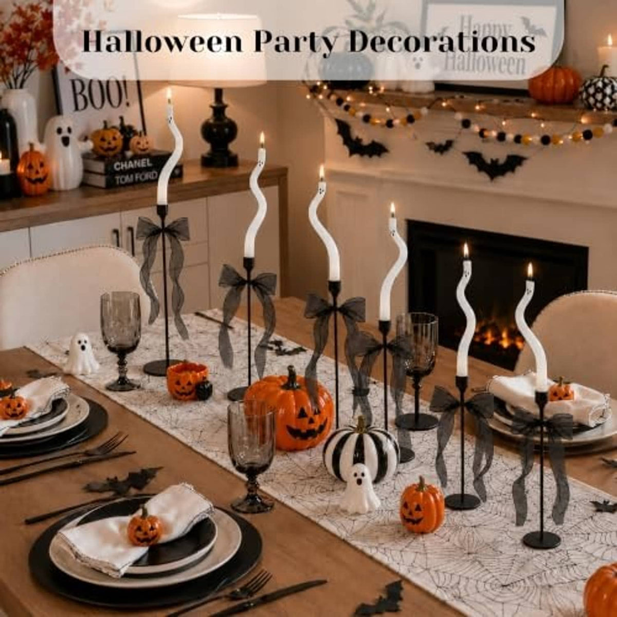 Twisting white ghost candle set with black bases, mesh bow accents, and flame tips