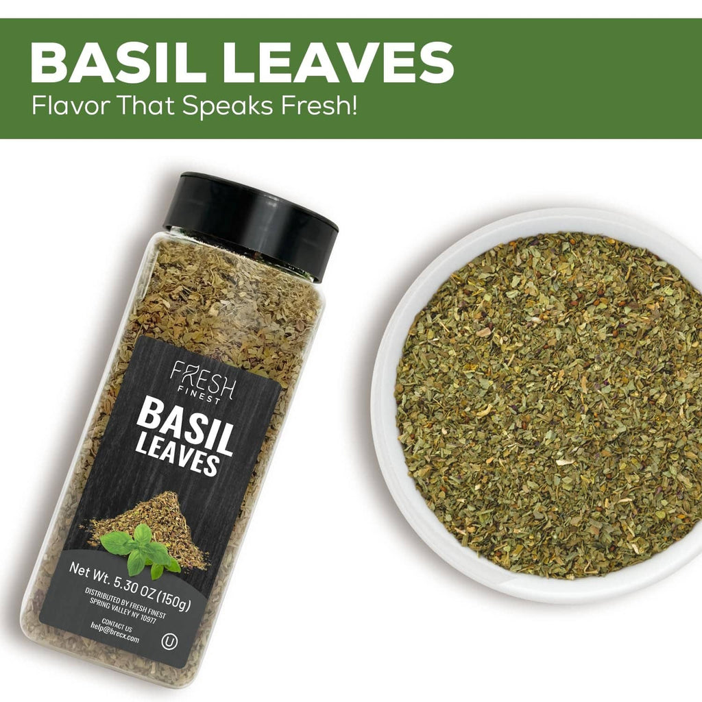 Dried basil leaves bottle and white bowl of dried herbs