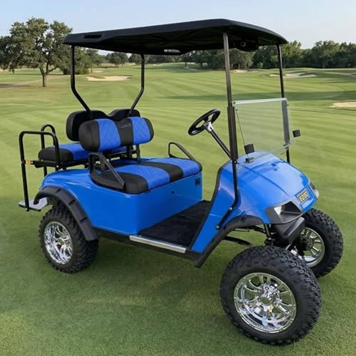 Blue and black seat cover set with headrests and split cushions on a golf cart