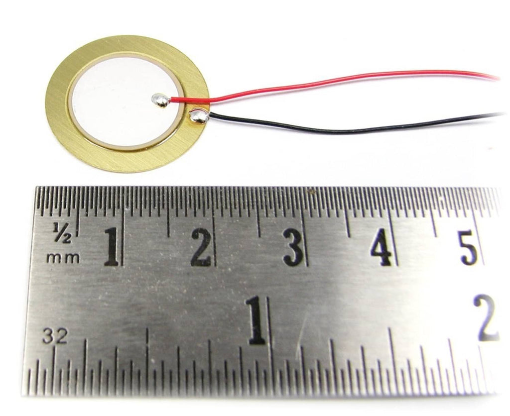 Single 20mm piezo disc pickup with red/black leads beside mm ruler
