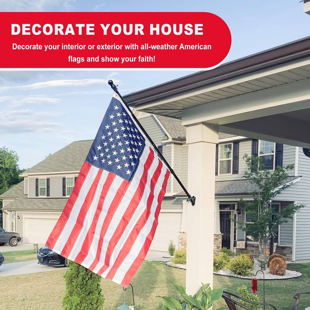 American flag waving on a house-front pole with blue stars and stripes