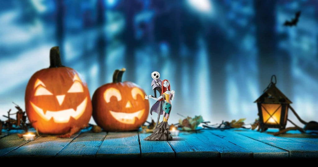 Jack and Sally-style figurine standing together on a decorated platform