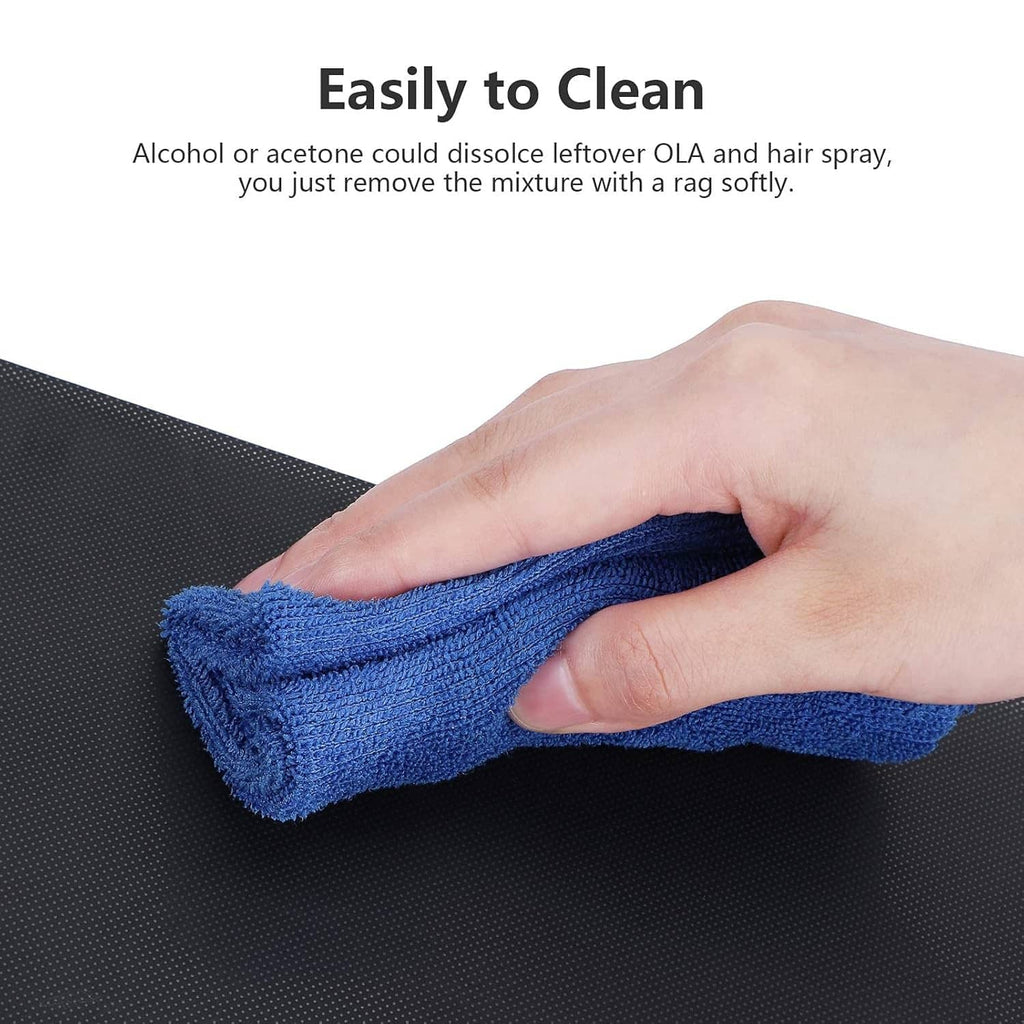 Creality glass bed platform with blue cloth being wiped by a hand