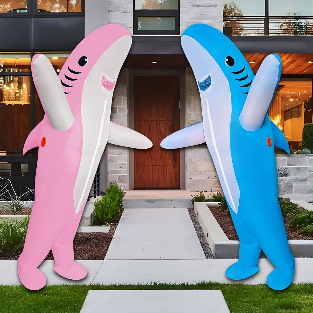 Inflatable pink and blue shark costumes, full-body standing side by side