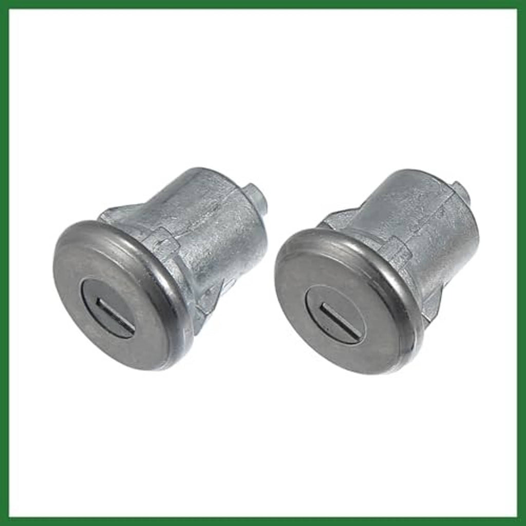 Two car door lock cylinders, silver metal with matching key lock faces