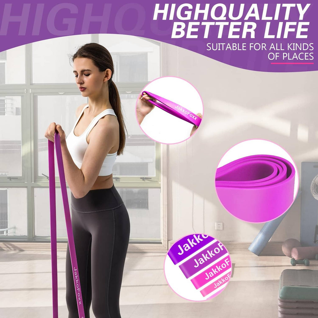Pink resistance band set and rolls, shown being held for upper-body workout