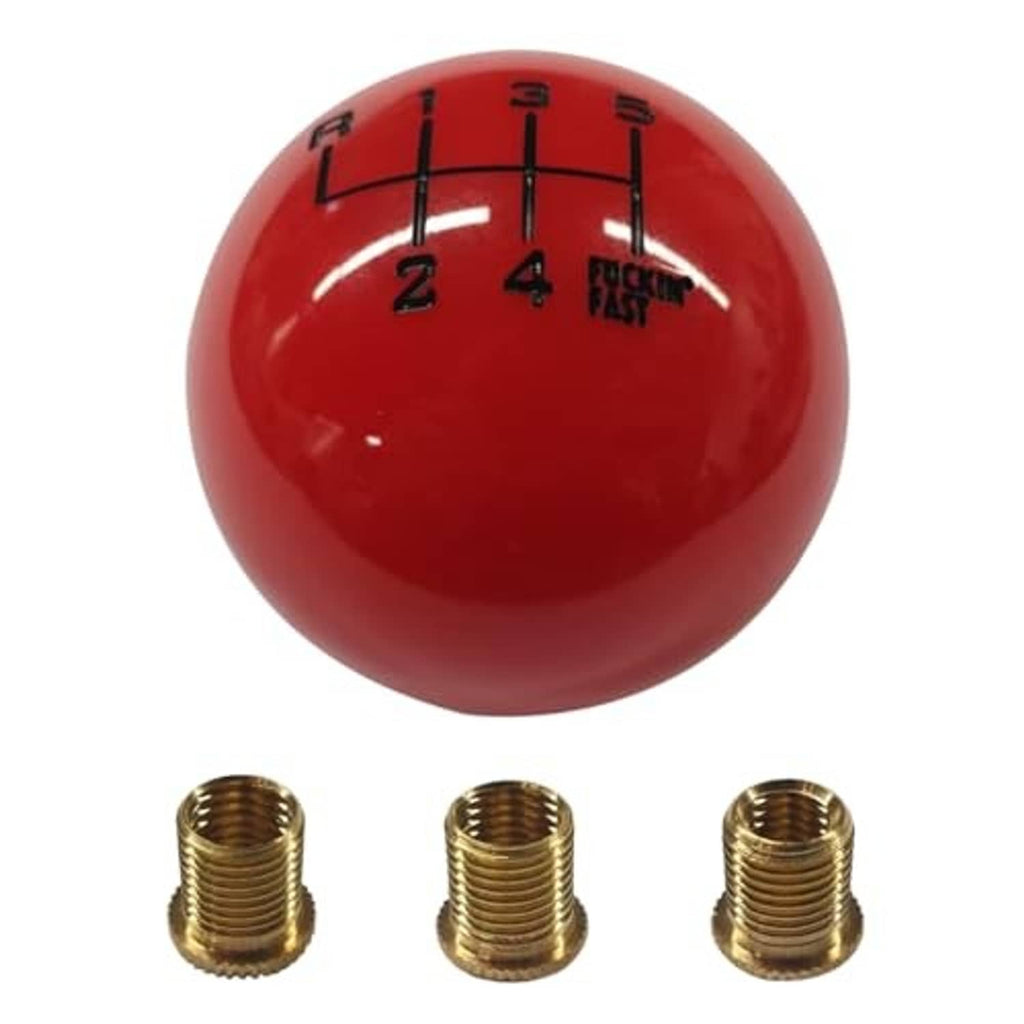 Red round gear shift knob with numbered 1–6 grid markings and brass threaded insert