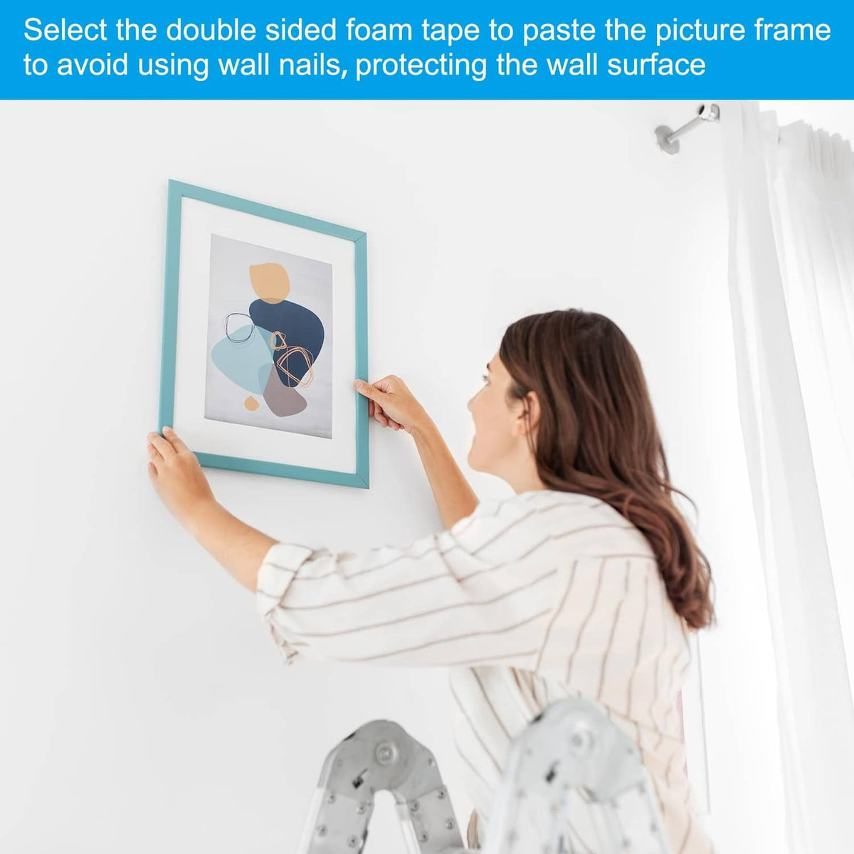 Black double-sided foam tape applying to picture frame for mounting