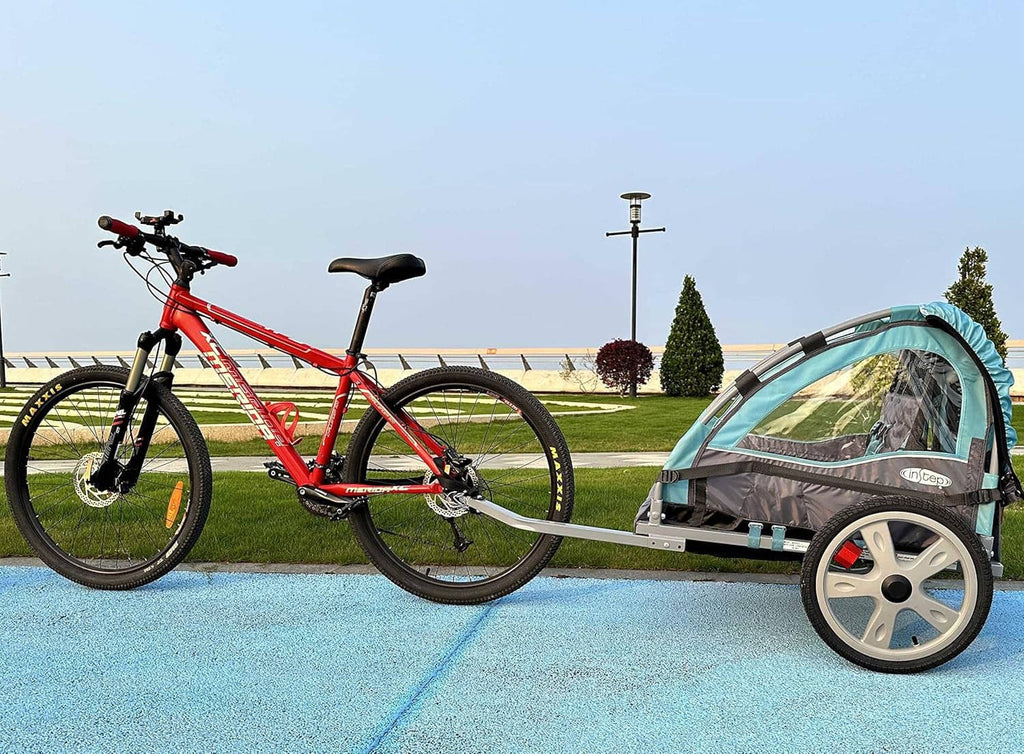 Bike trailer hitch coupler connecting a bike to a small cargo trailer