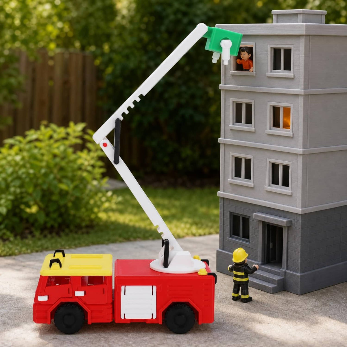 PLA 3D-printed toy fire truck with ladder and a small building model