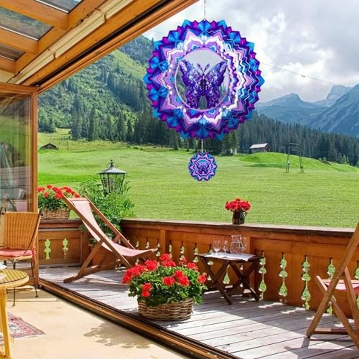 Butterfly wind spinner hanging outdoors, blue-purple rosette with butterfly center and pendant
