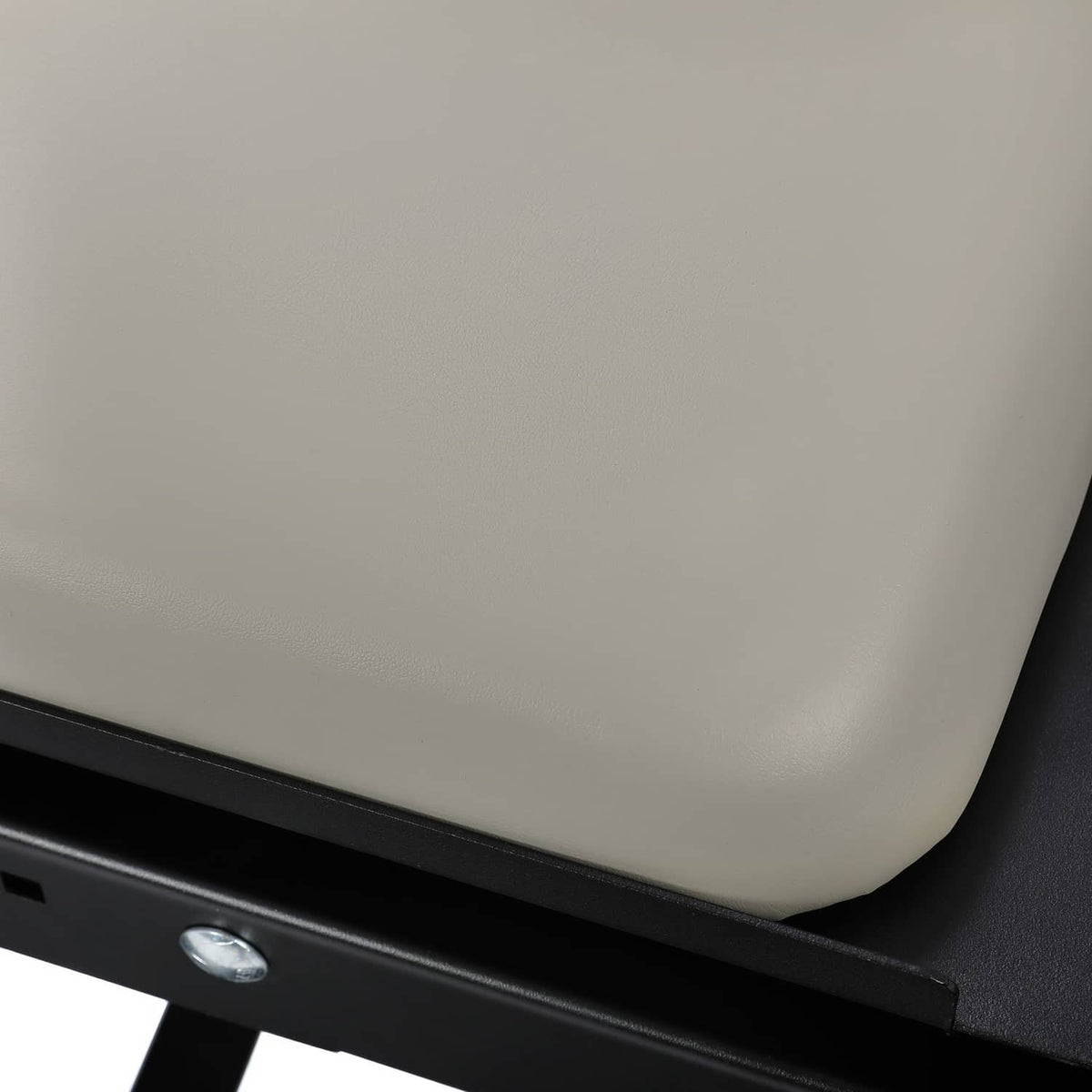 Gray rear flip seat pad on black metal frame bracket