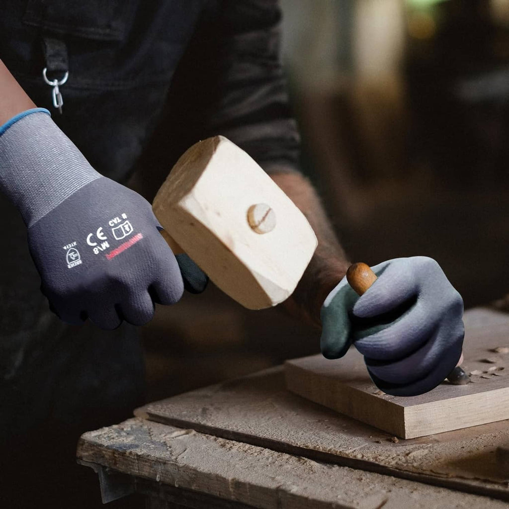 Gloved hands wearing gray knit-and-black nitrile grip gloves placing a wooden block