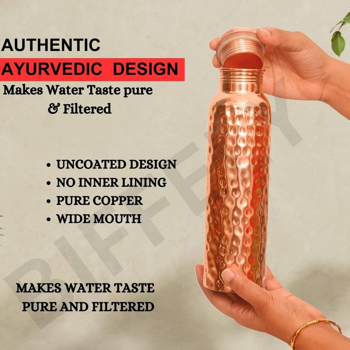 Copper water bottle with hammered pattern, held by the lid and top opening.