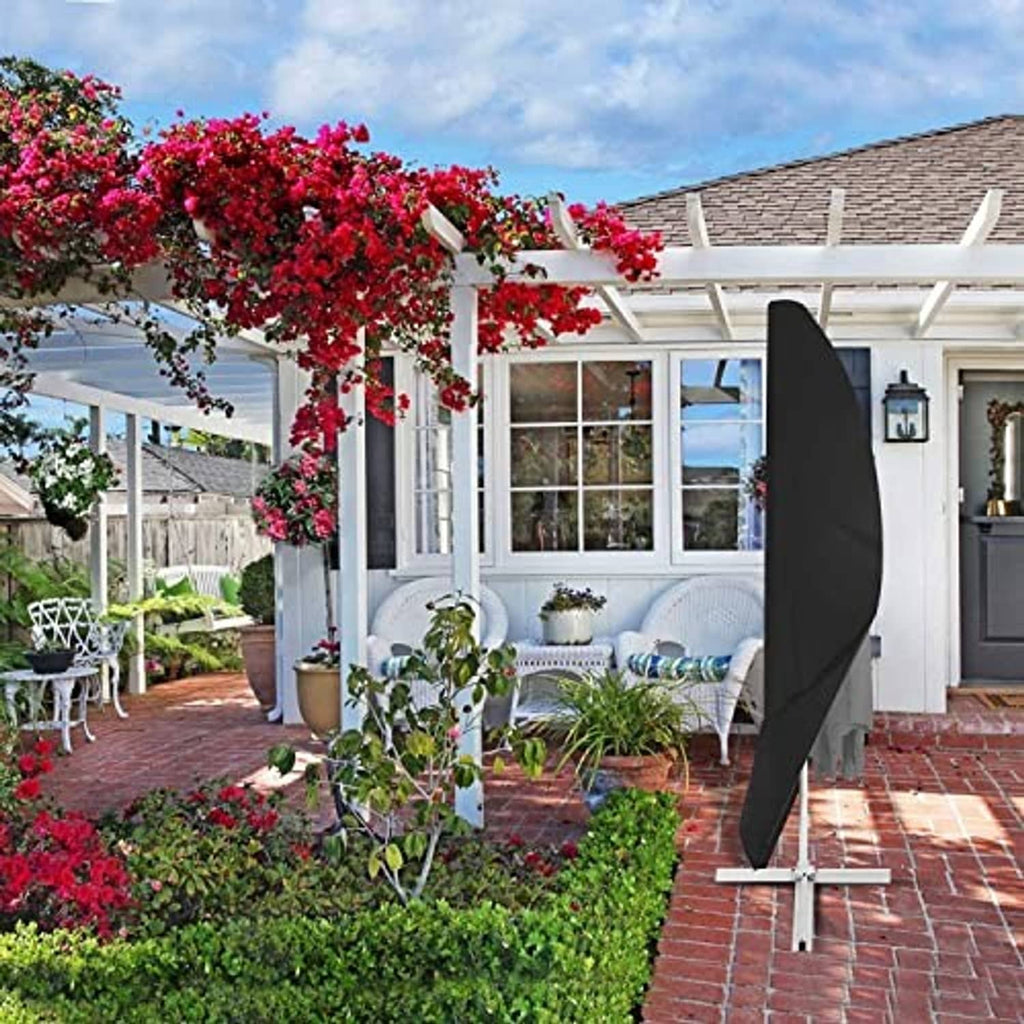 Black umbrella cover on a cantilever stand outdoors, protecting the canopy