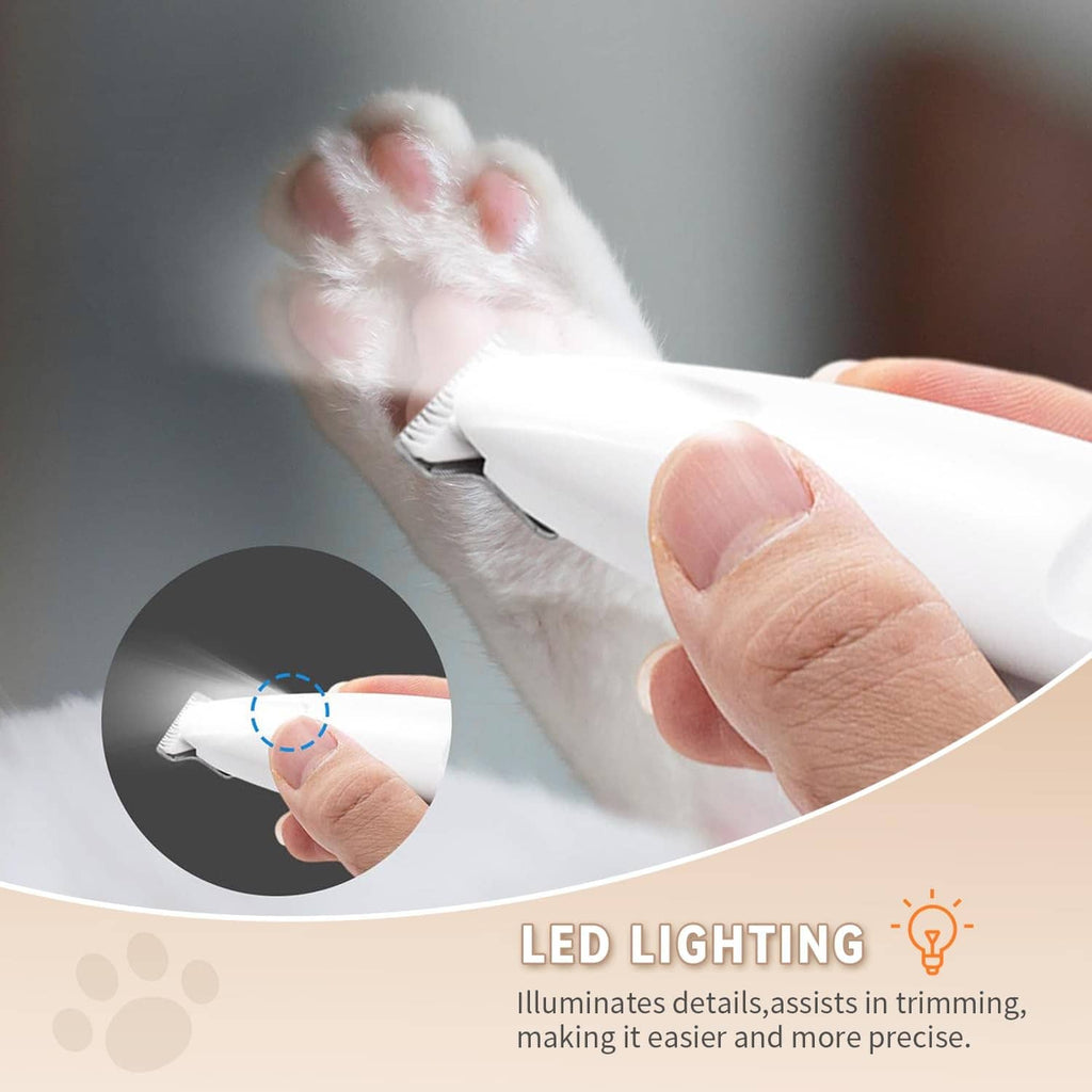 White LED-lit pet trimmer guide comb trimming a small paw fur section