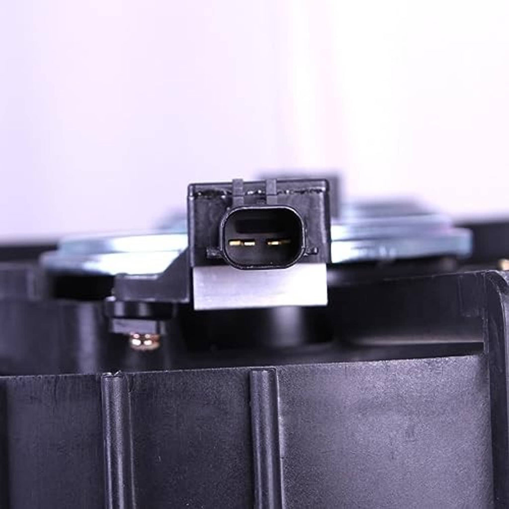 Radiator fan motor connector on black fan shroud, close-up