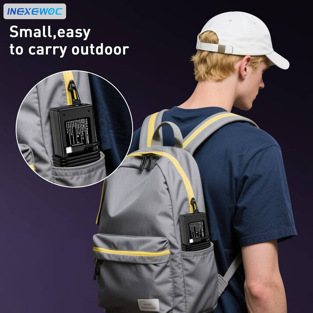 Black 65W USB-C charger clipped inside backpack pocket with cable