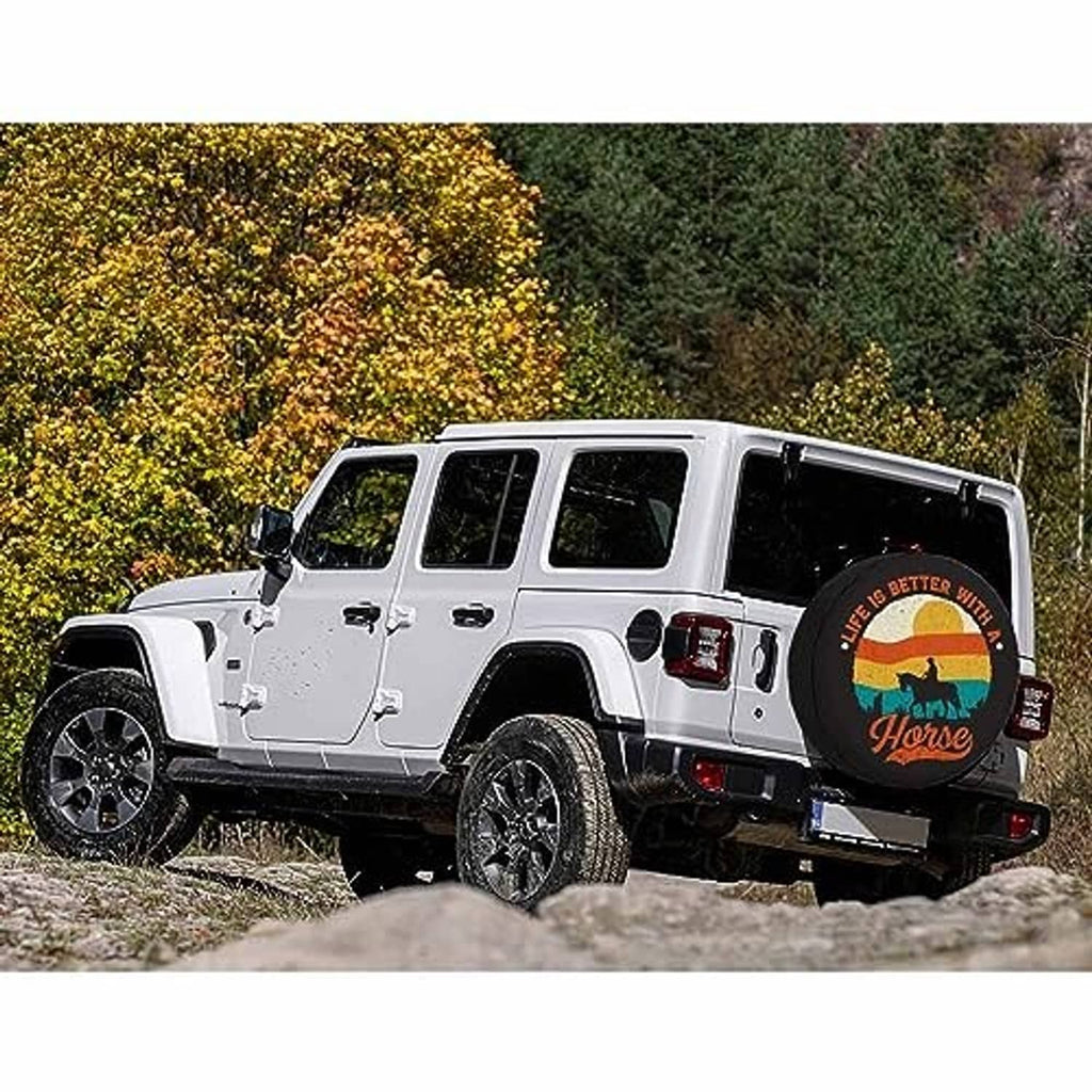 Round horse spare tire cover installed on a white SUV on a dirt road