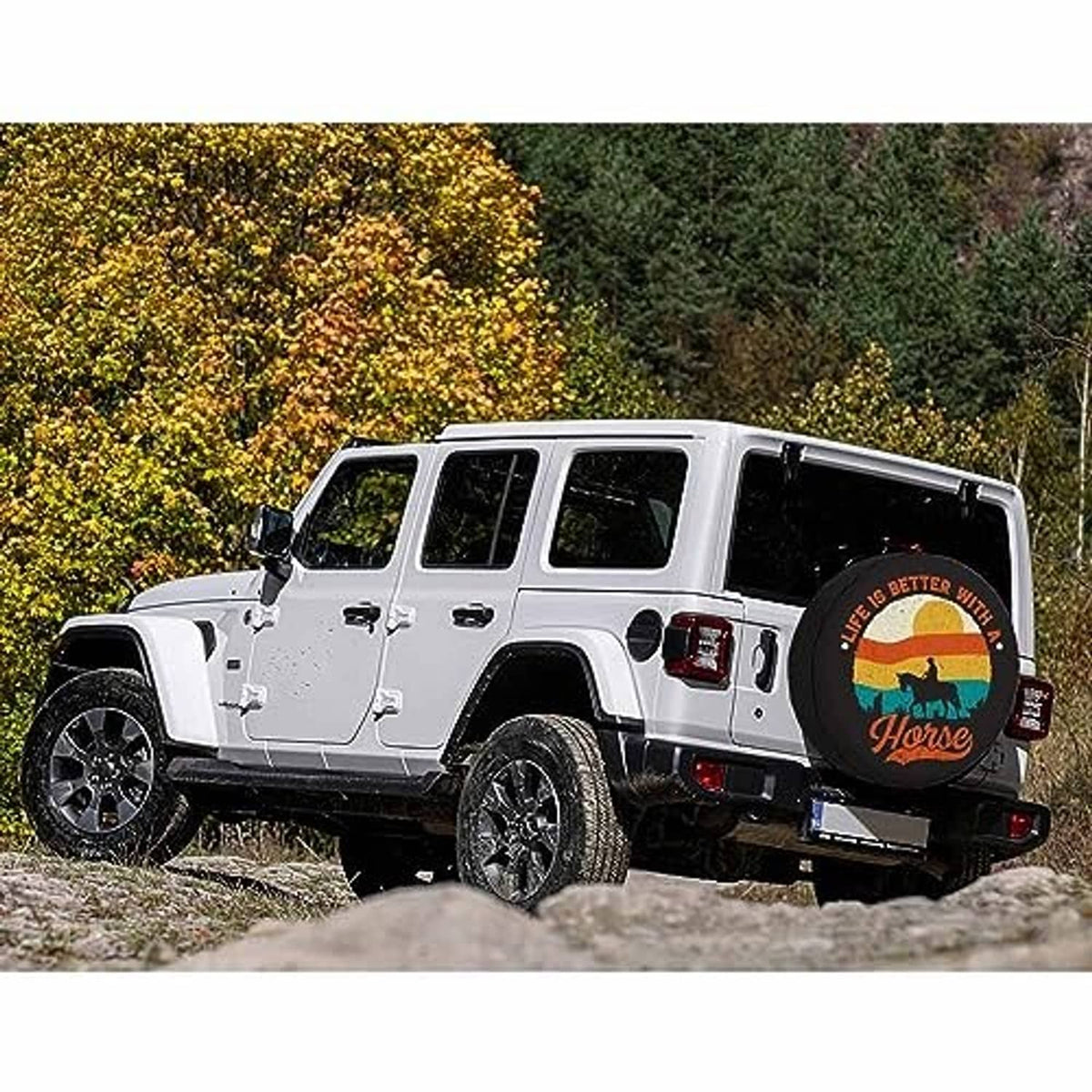 Round horse spare tire cover installed on a white SUV on a dirt road