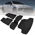 Black rubber floor mat set with textured grooves and raised edges
