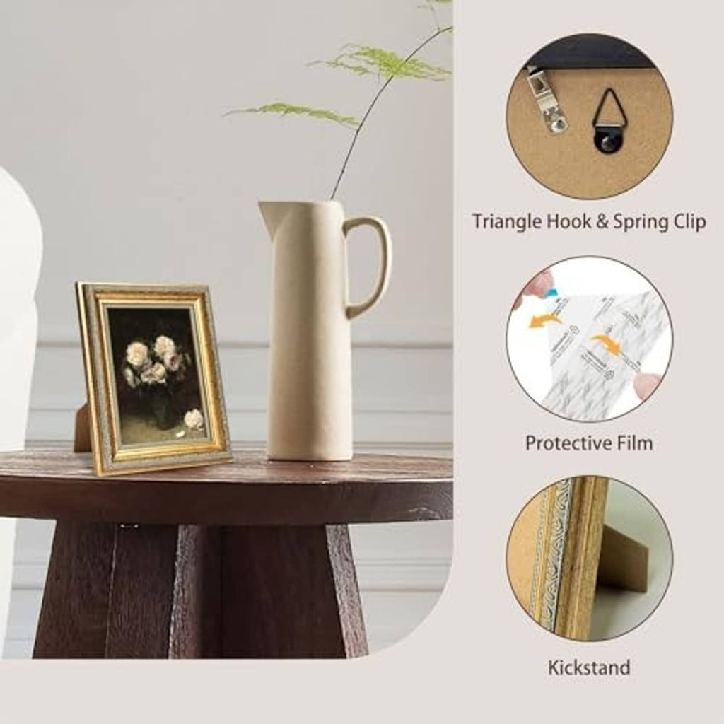 Gold tabletop picture frame with clear glass and kickstand, leaning on a wooden surface