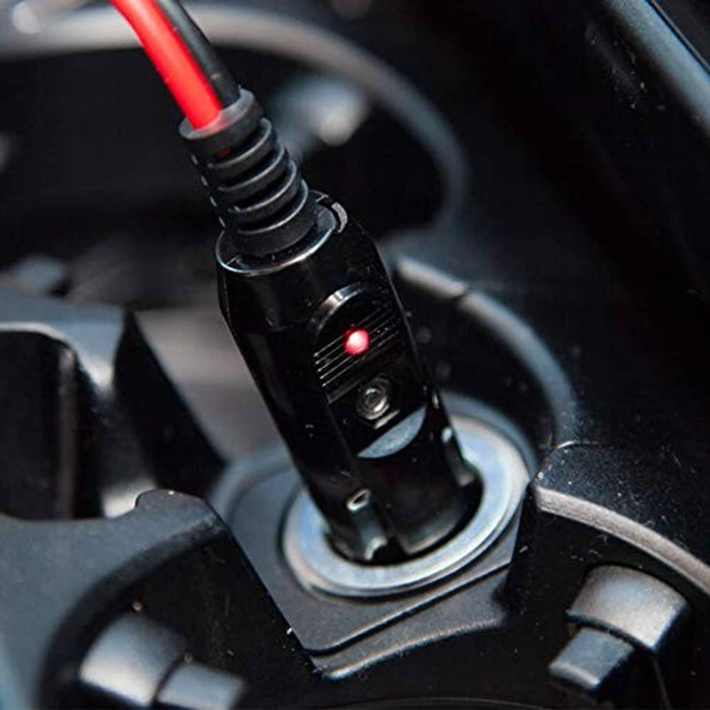 12V fused car cigarette lighter male plug with LED indicator inserted in dashboard socket