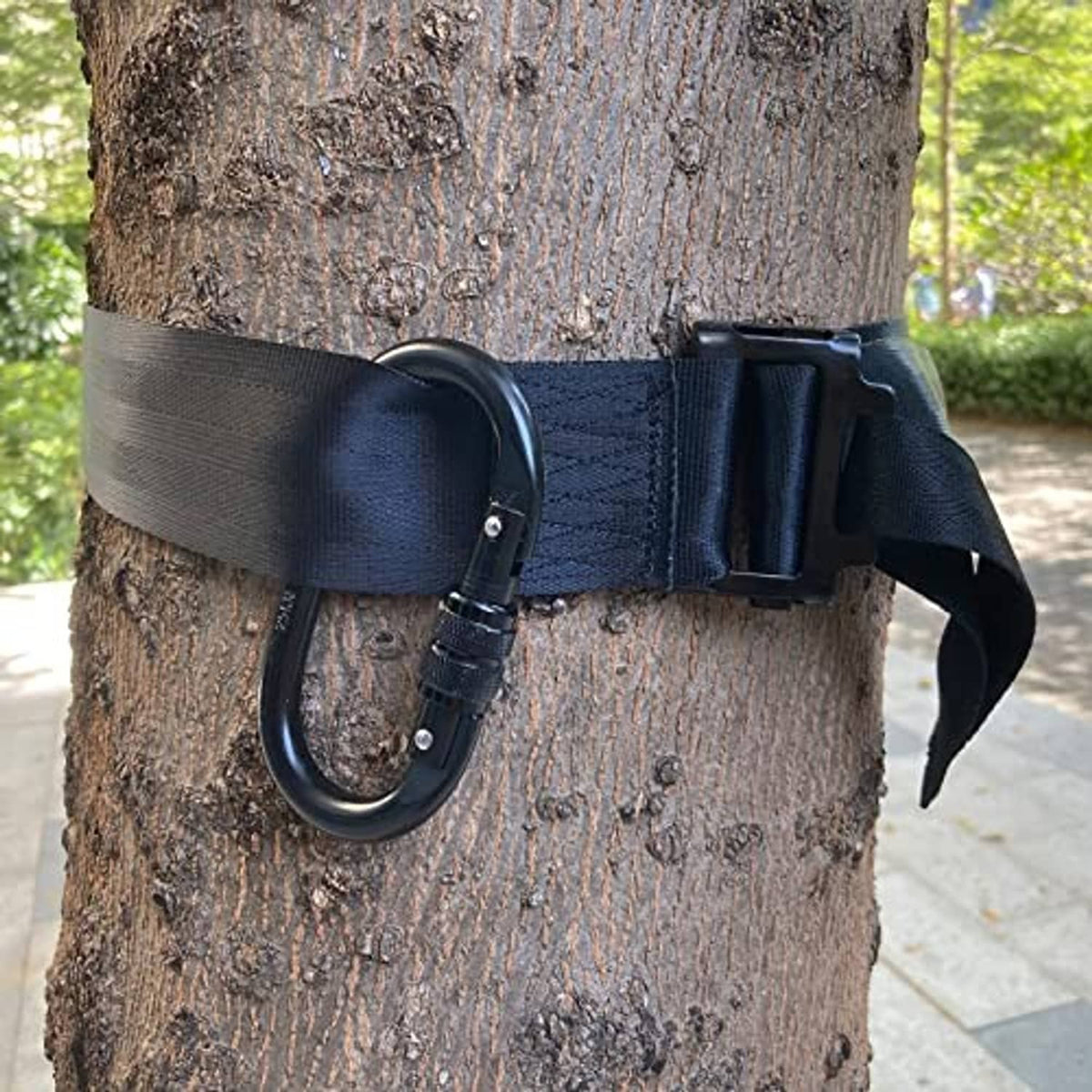 Dark blue tree strap with metal D-ring, buckle, and loose fastening end