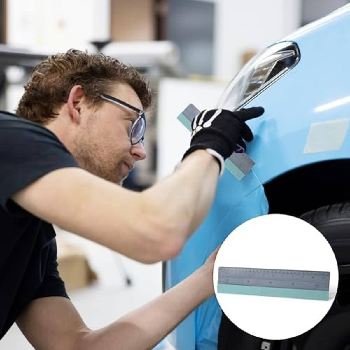 Felt squeegee smoothing tool pressed to a blue car window film