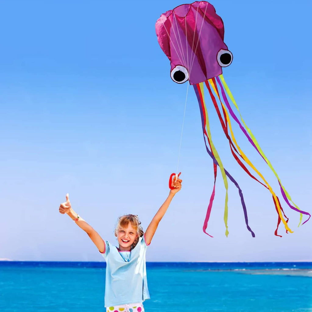Octopus kite with pink-purple head and long multicolor ribbon streamers