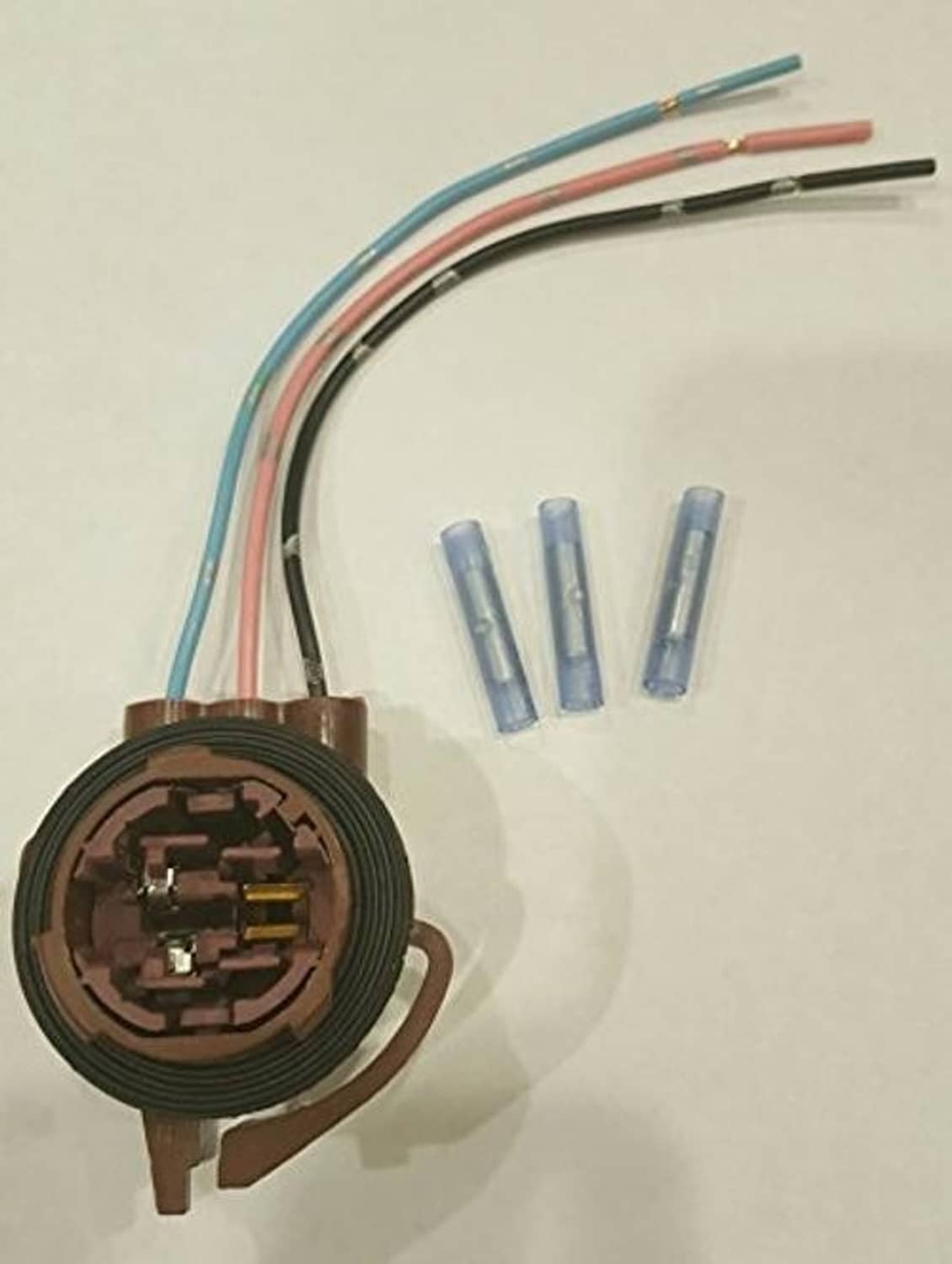 Light socket pigtail repair connector with brown housing, blue terminals, and bundled wires