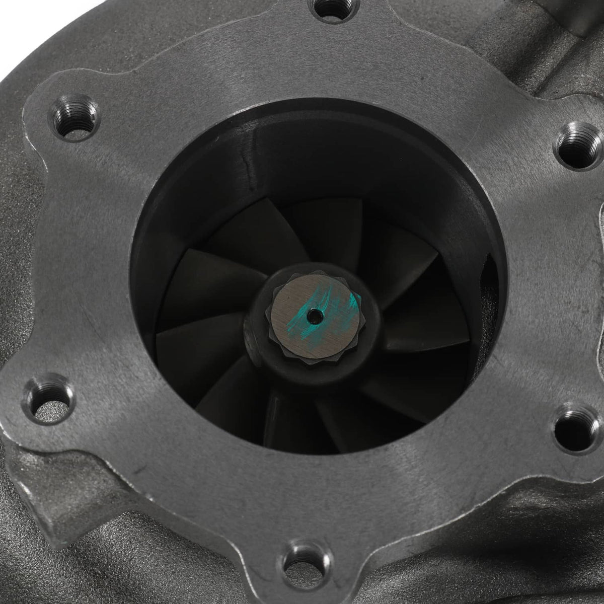 Turbocharger compressor inlet close-up with dark wheel blades