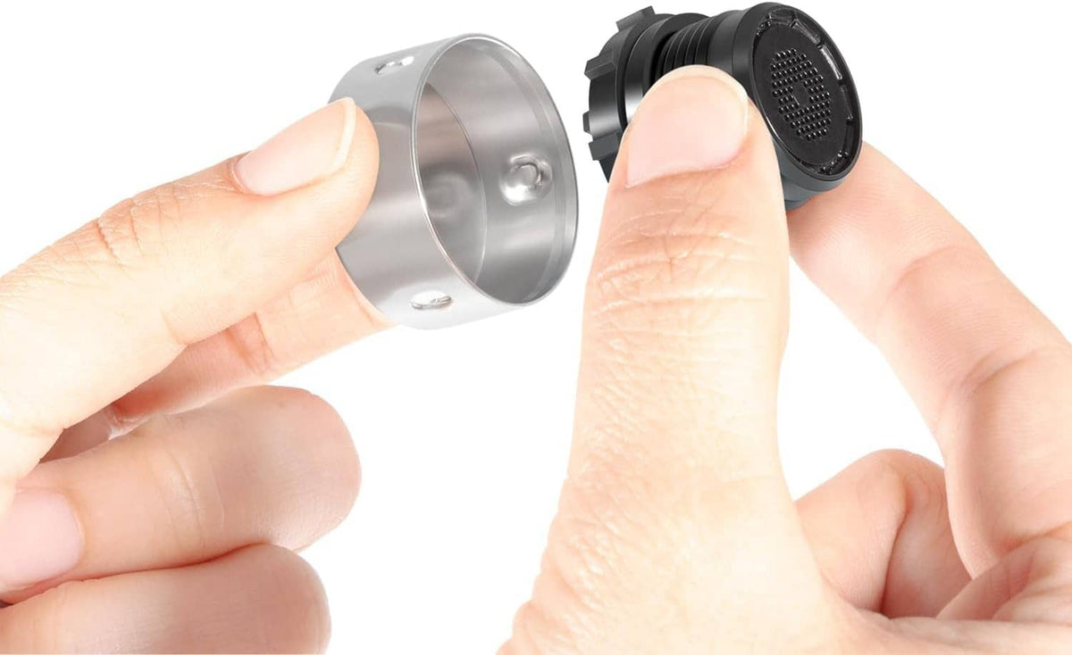 Vacuum breaker repair kit: hands installing silver cap onto black valve insert