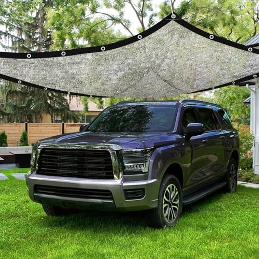 Gray aluminum shade cloth tarp suspended over a parked SUV, curved roof with grommets