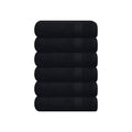 Black hand towel set, five neatly stacked folded towels with smooth textured fabric