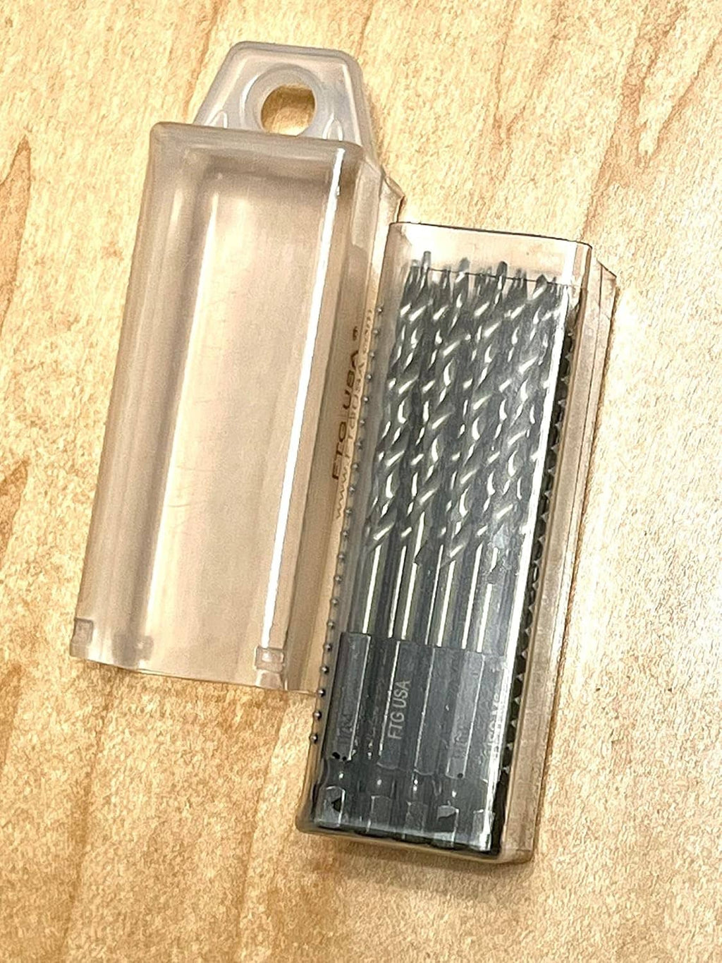 Translucent extendable storage case holding countersink drill bits inside