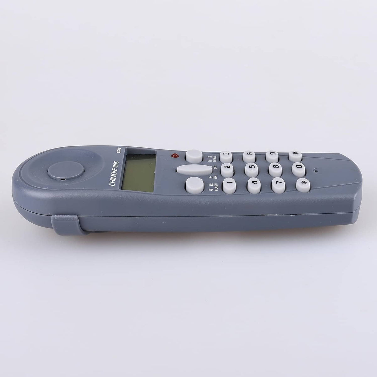 Phone line tester side view with keypad, LCD, and round power button