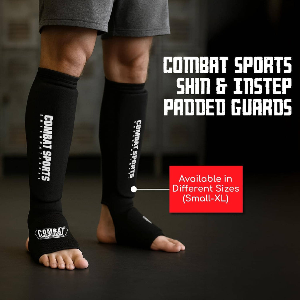 Black padded shin guards covering shins and instep on bare feet