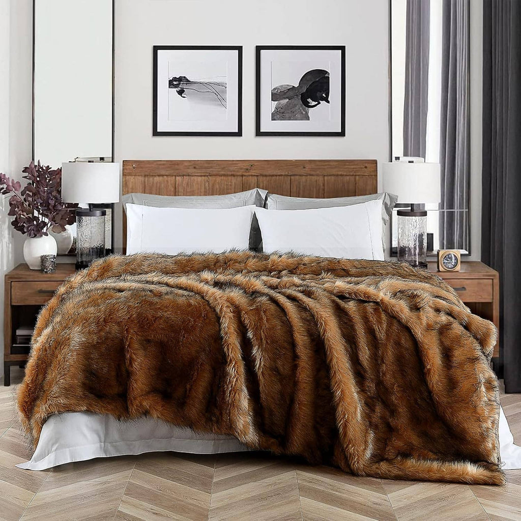 Brown faux fur blanket with black tips, long pile, spread across bed