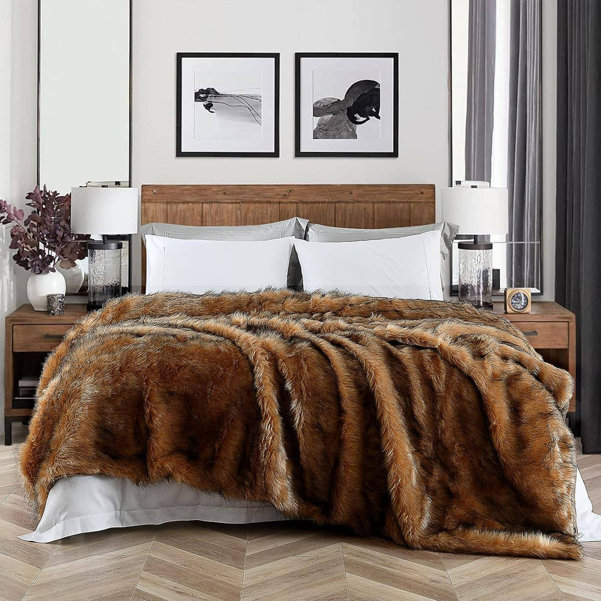 Brown faux fur blanket with black tips, long pile, spread across bed