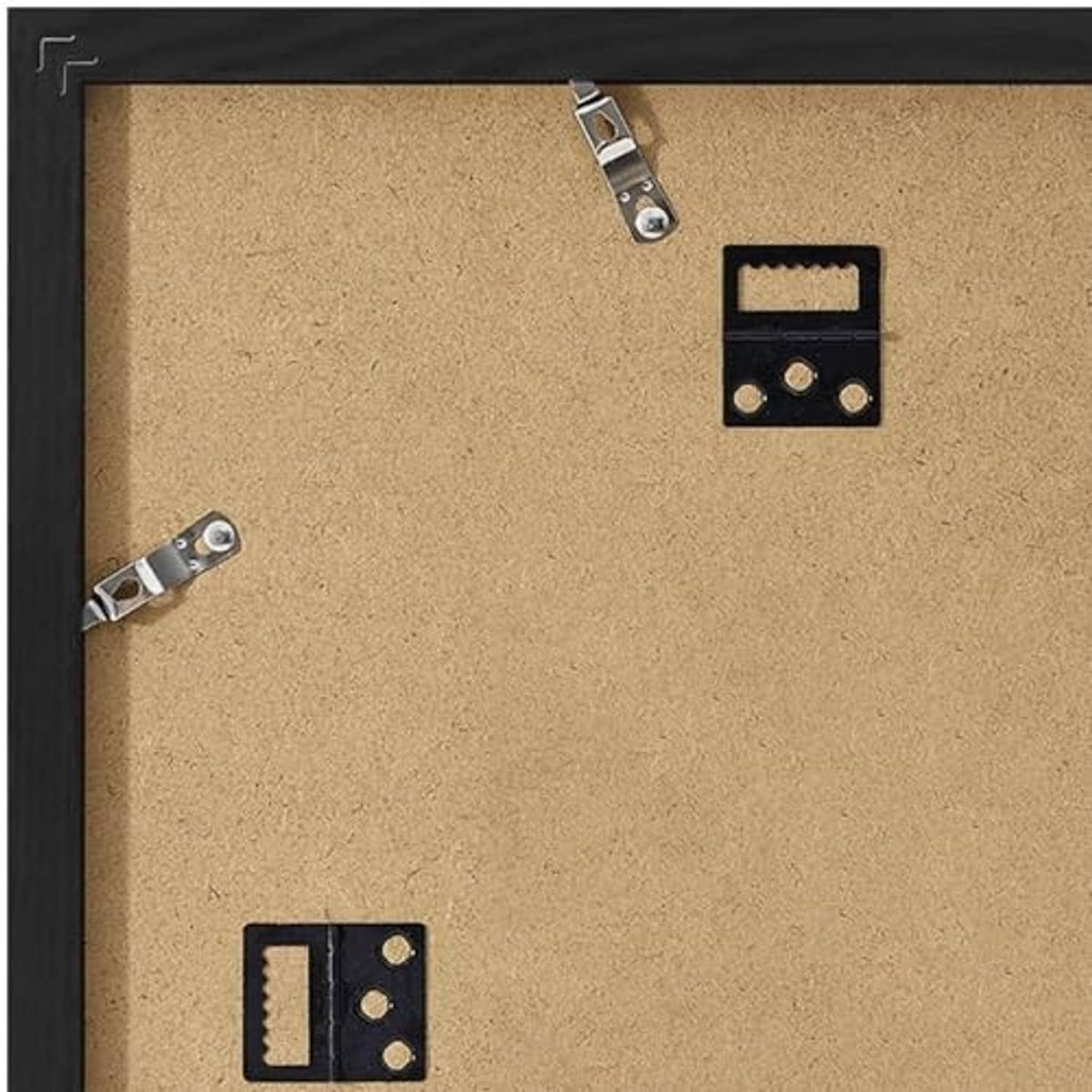 Back of black picture frame with corkboard surface and metal hanging hardware